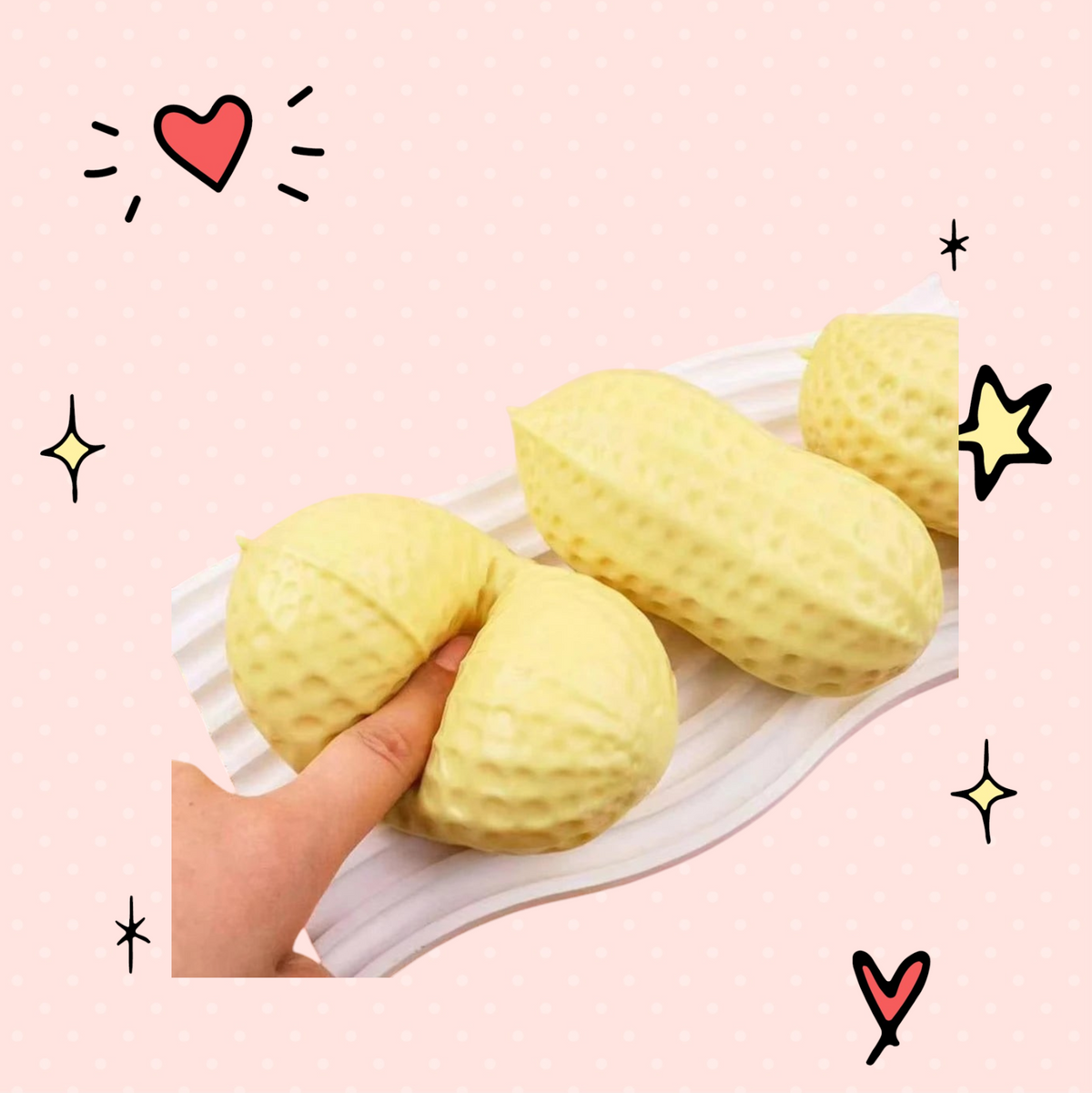 Foundry FitFit Plentiful Peanut Squishy stress-relief toy being squeezed, featuring a soft, textured yellow design.