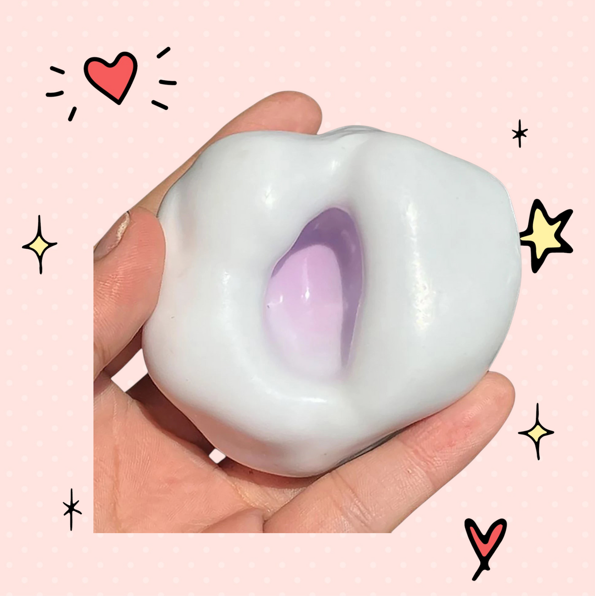 Foundry FitFit white and purple sand-filled glutinous stress ball held in a hand for sensory anxiety relief