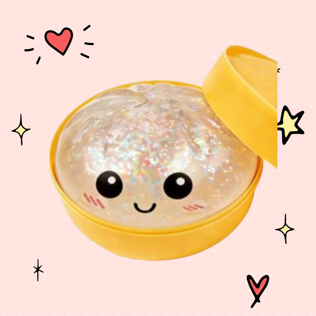 Foundry FitFit translucent glitter dumpling squishy toy with a cute smiling face in a yellow container