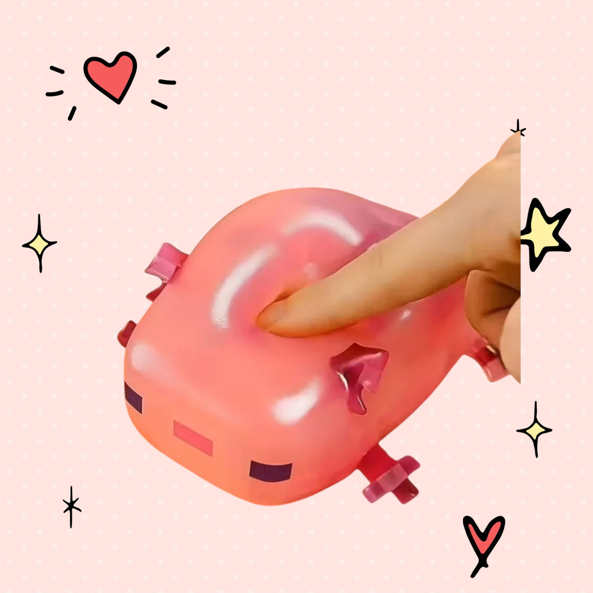 Foundry FitFit pink axolotl squishy toy being squeezed by a finger for stress relief on a cute patterned background
