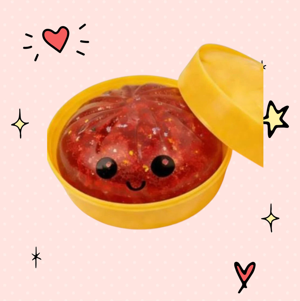 Foundry FitFit red glitter dumpling squishy toy with a cute smiling face in a yellow container
