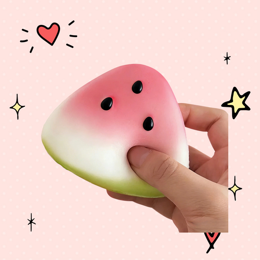 Foundry FitFit watermelon-shaped squishy latex fidget toy being squeezed by a hand for stress relief