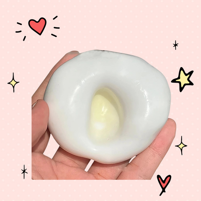Foundry FitFit white glutinous sand stress ball being squeezed in a hand for anxiety relief