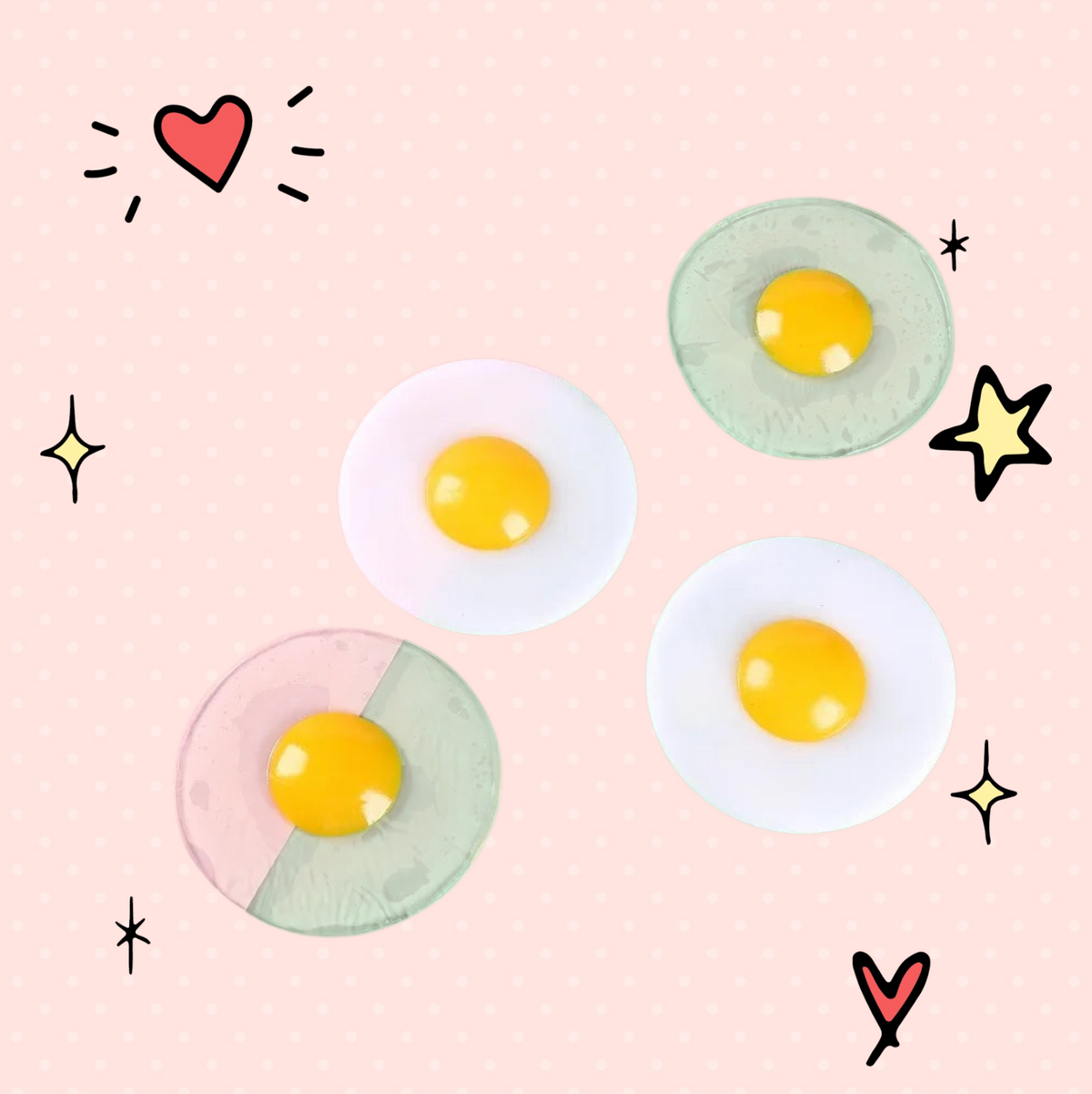 Foundry FitFit egg-shaped squishy fidget toys with clear and white bases and bright yellow yolks on a two-tone background