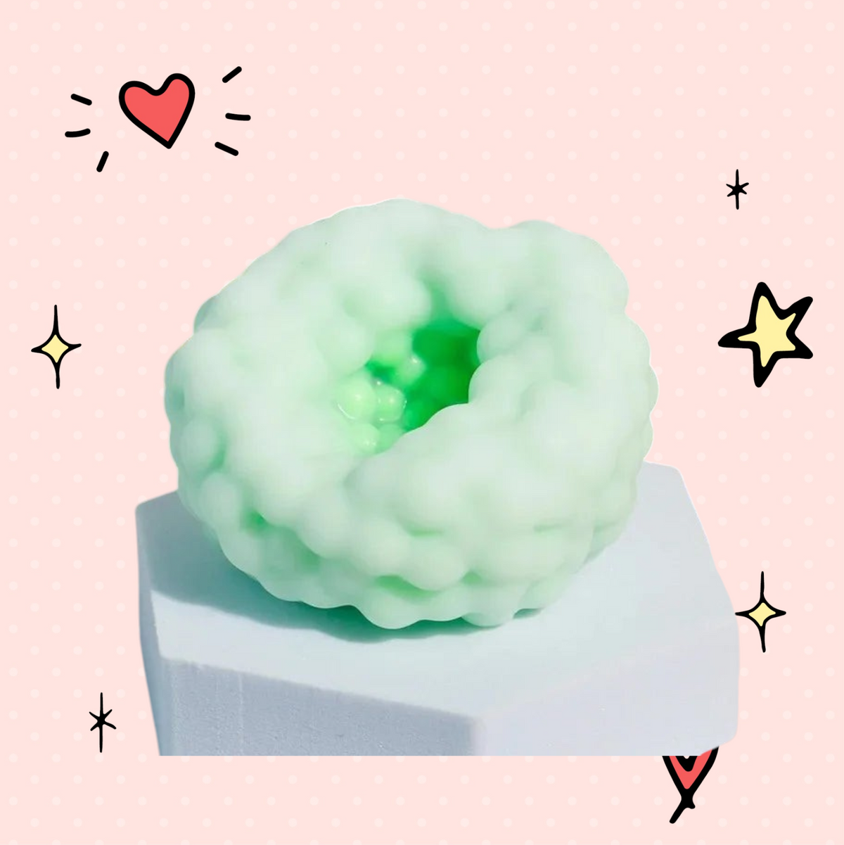 Foundry FitFit light green crunchy sensory stress ball with a textured, bumpy surface on a white pedestal.