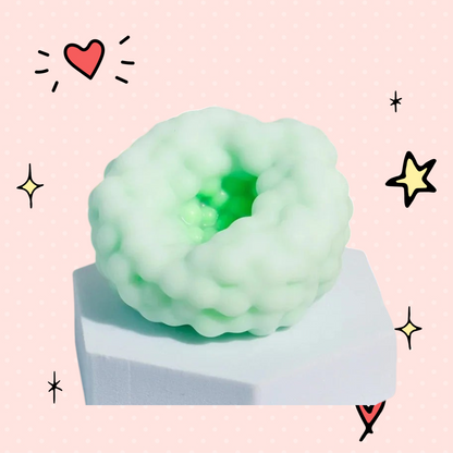 Foundry FitFit light green crunchy sensory stress ball with a textured, bumpy surface on a white pedestal.