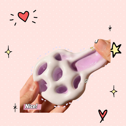 Foundry FitFit purple and white glutinous rice ball squishy toy being stretched by hand for stress relief