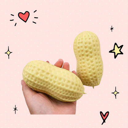 Foundry FitFit Plentiful Peanut Squishy stress-relief toy held in hand with additional peanuts in a pink basket.