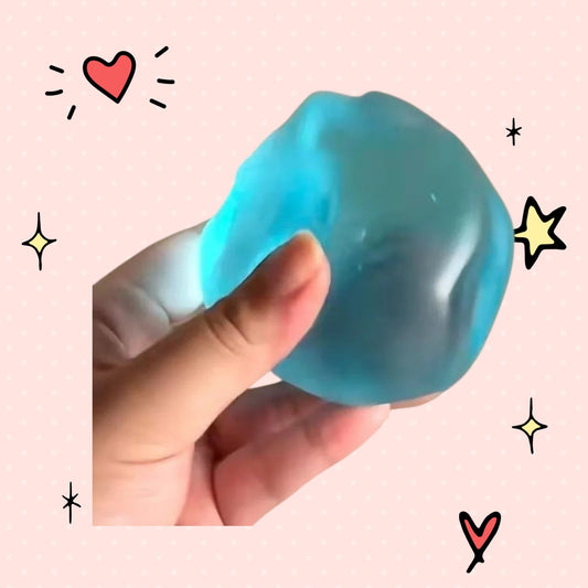 Foundry FitFit blue transparent squishy ball with a soft jelly-like texture being held for stress relief