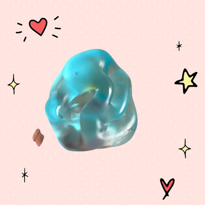 Foundry FitFit blue transparent squishy ball with a jelly-like texture being held in a hand for sensory stress relief