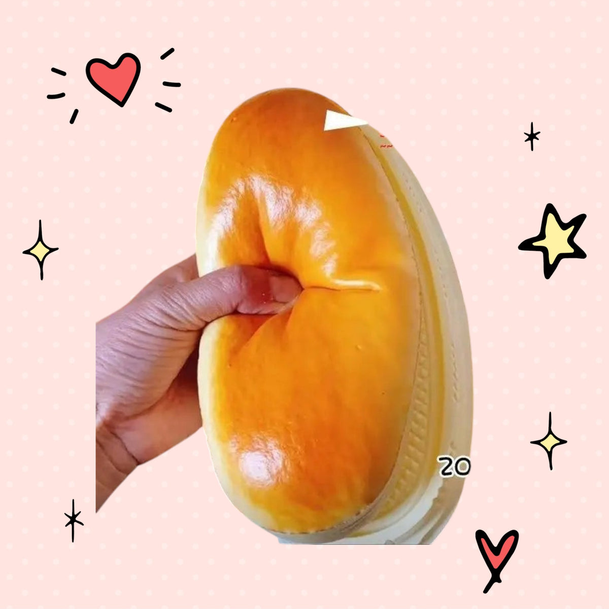 Foundry FitFit golden-brown bread squishy toy being squeezed to show slow-rebound PU material in plastic packaging