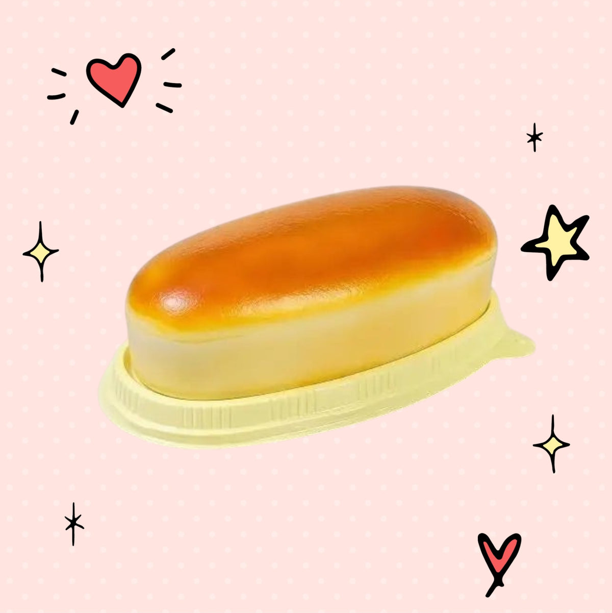 Foundry FitFit golden-brown bread squishy stress relief toy on a yellow tray with cute hand-drawn doodle accents.