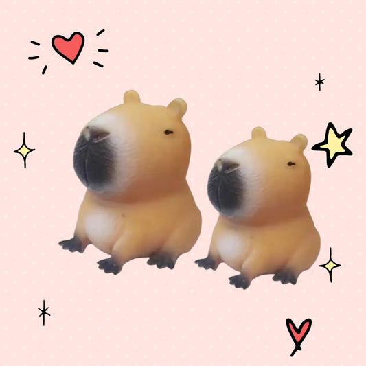 Foundry FitFit capybara squishy toys in small and large sizes with soft tan silicone texture and black details.
