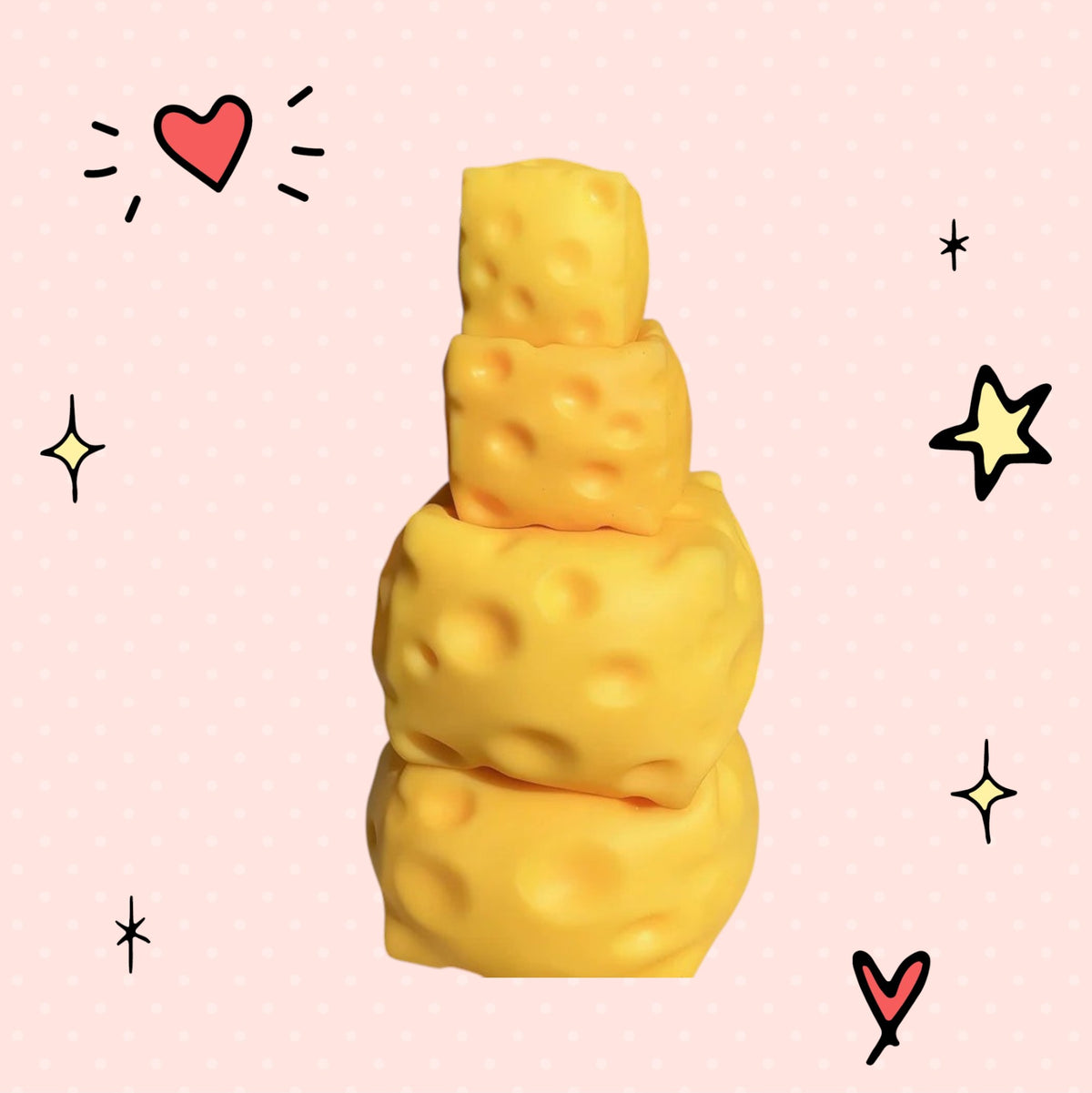 Foundry FitFit yellow cheese block squishy fidget toys stacked on a pink background with hand-drawn doodle accents.