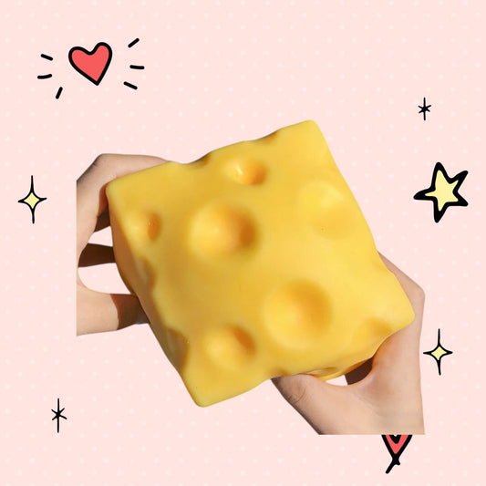 Foundry FitFit yellow cheese block squishy fidget toy being held in hands