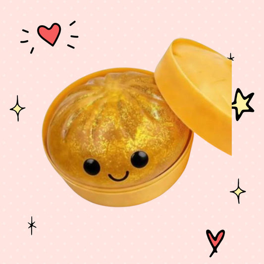 Foundry FitFit gold sequin dumpling-shaped squishy toy with a cute smiling face and slow-rebound foam texture.