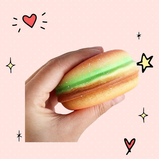 Foundry FitFit hamburger squishy toy held in hand, featuring soft TPR material for stress relief and sensory play.