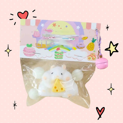 Foundry FitFit white hamster squishy toy holding a yellow cheese slice in its original clear plastic packaging