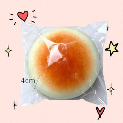 Foundry FitFit honey bread squishy in clear packaging, featuring a soft orange and white pastry design for stress relief
