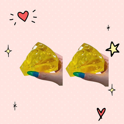 Foundry FitFit yellow honey-drizzled cheese wedge squishy toy made of soft slow-rise foam for stress relief