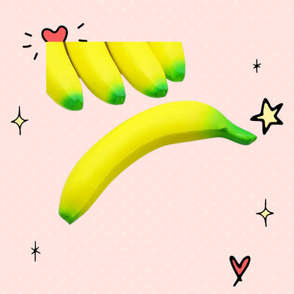 Foundry FitFit jumbo banana squishy toy in bright yellow with green tips, made of soft slow-rise foam.