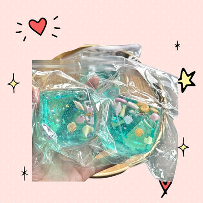 Foundry FitFit ocean-themed squishy cube filled with clear gel, seashells, and star charms for sensory fidget play.