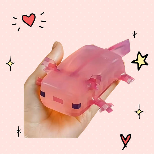 Foundry FitFit pink axolotl squishy toy held in a hand, featuring a soft, slow-rebound design for stress relief.