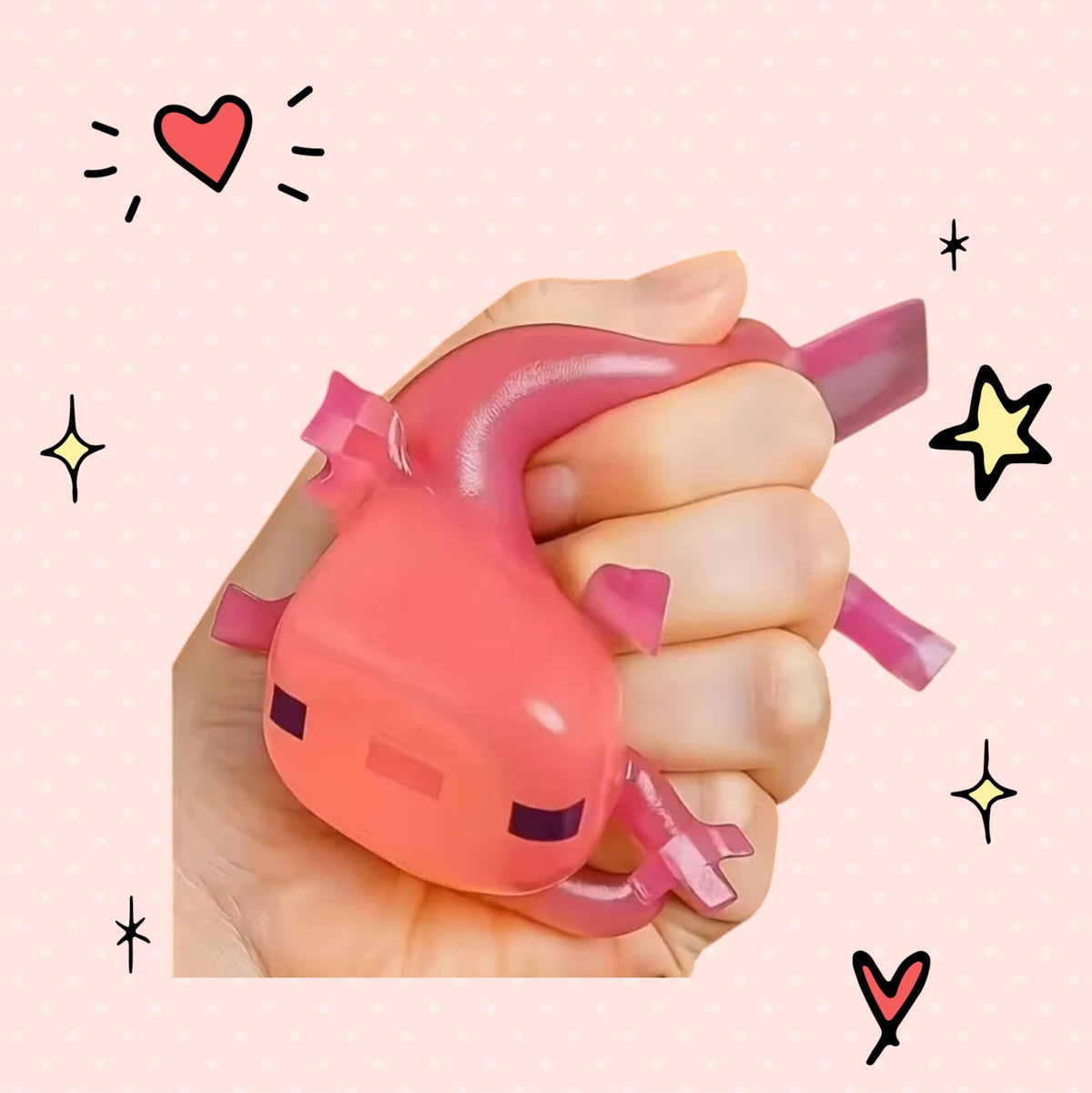 Foundry FitFit pink axolotl squishy toy being squeezed in a hand for stress relief on a cute patterned background.