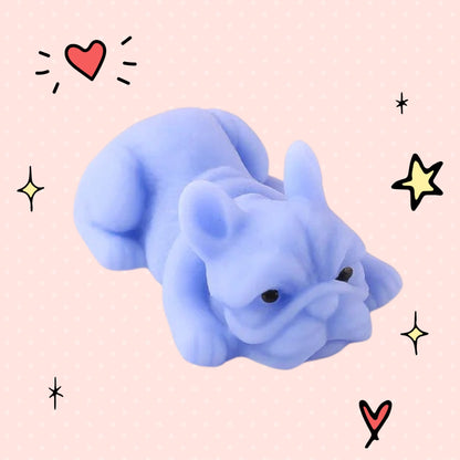 Foundry FitFit light purple kawaii French bulldog squishy toy with a soft slow-rise texture on a pink dotted background