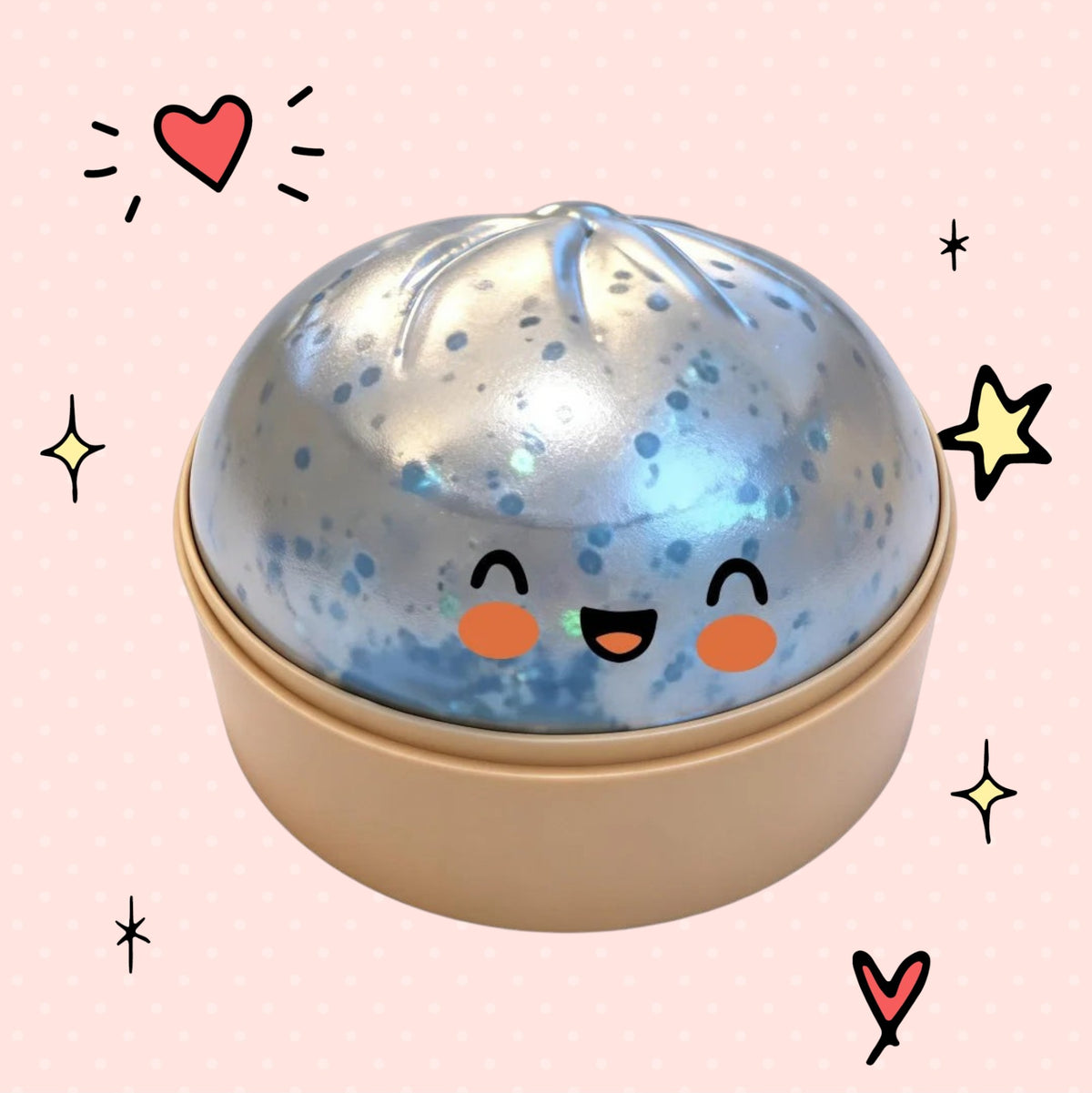 Foundry FitFit silver sequin dumpling squishy toy with a cute smiling face in a beige container