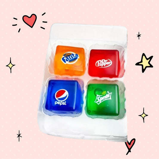 Foundry FitFit Squishy Sodas collection featuring four colorful, cube-shaped soda-themed fidget toys in a tray.