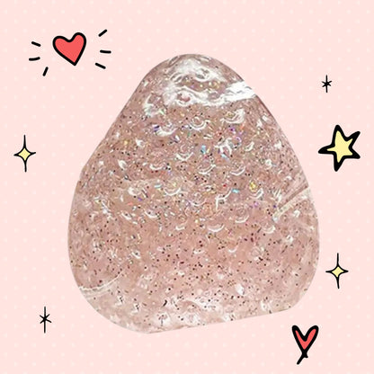 Foundry FitFit strawberry-shaped squishy toy with glittery pink texture, perfect for stress relief and fidgeting.