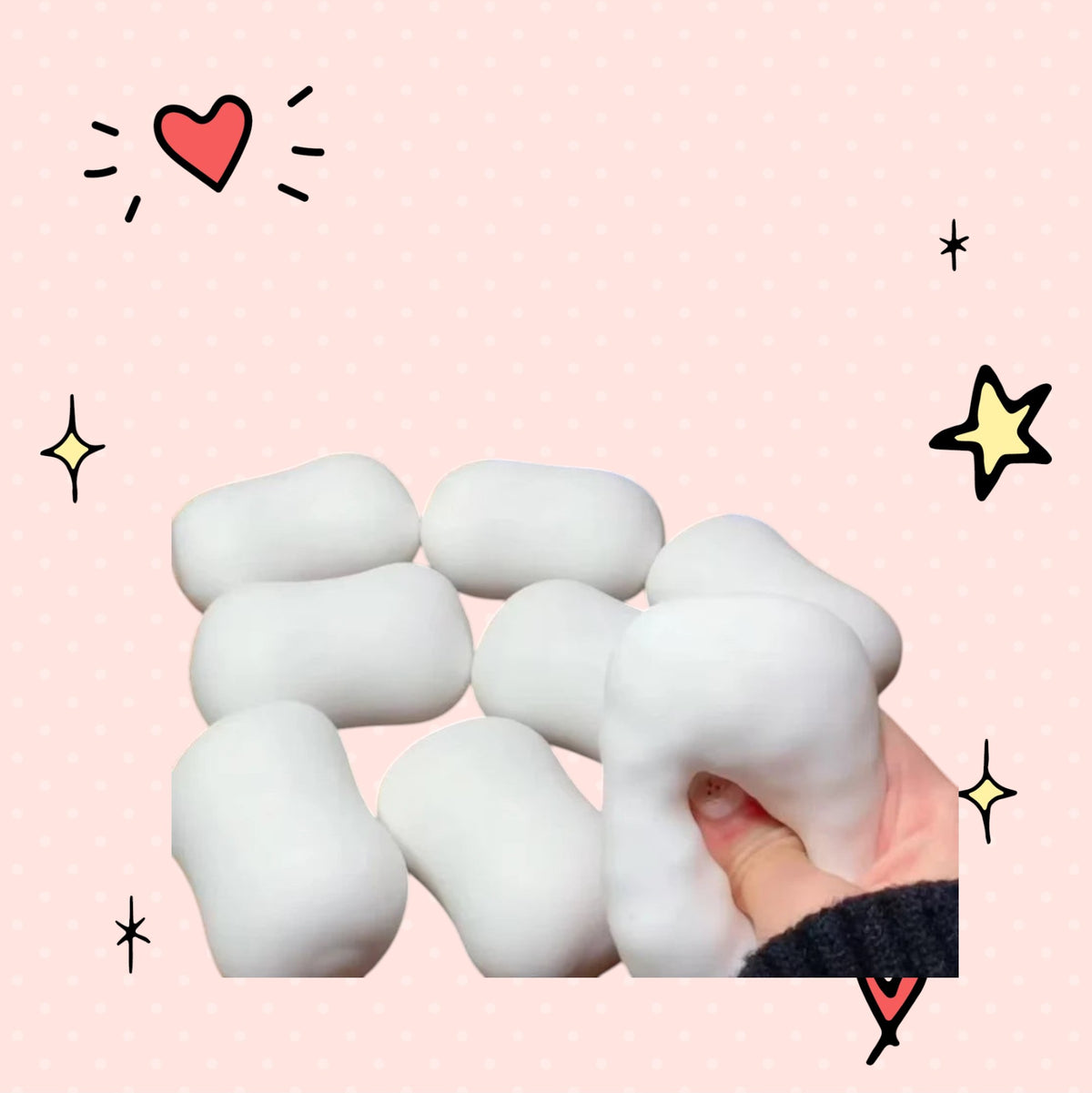 Foundry FitFit Super Soapy Squishy white foam stress relief toy being squeezed by a hand on a pink background