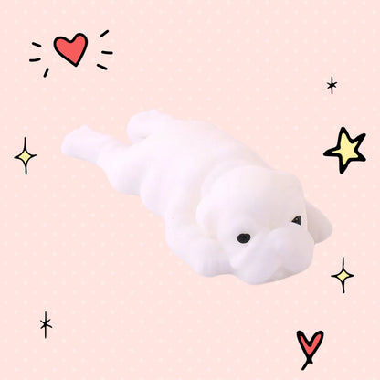 Foundry FitFit white puppy squishy toy with a sleepy kawaii expression on a pink background with doodle stars and hearts