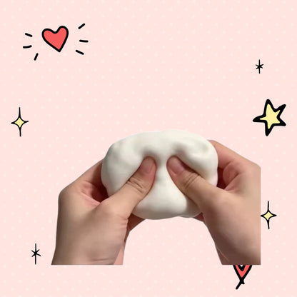 Foundry FitFit Super Soapy Squishy white foam stress relief ball being squeezed by hands on a pink background