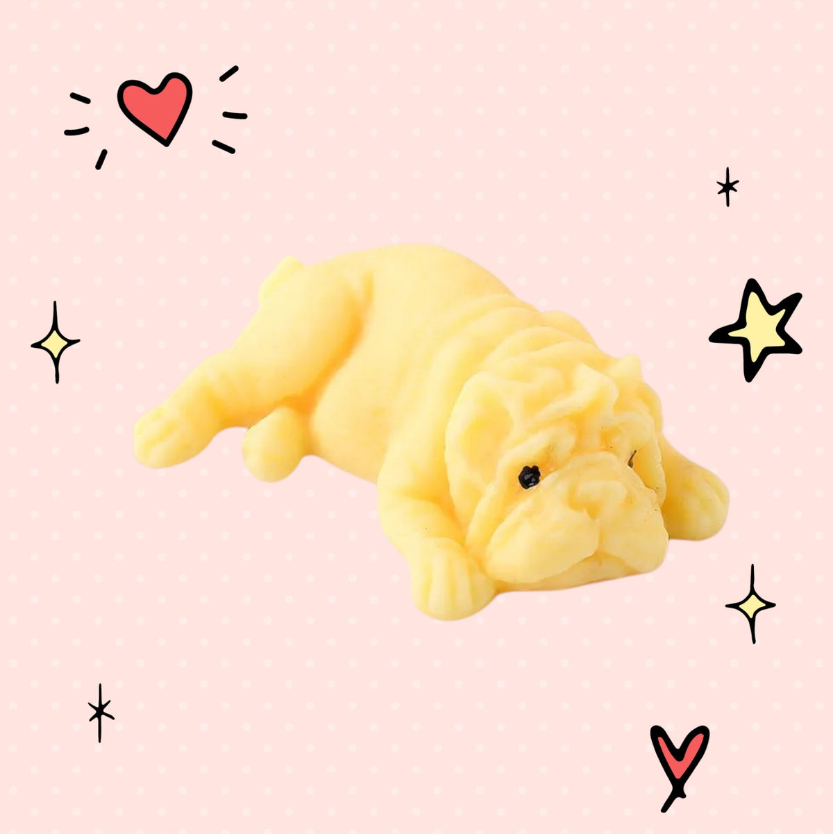 Foundry FitFit yellow puppy squishy toy with a sleepy kawaii expression on a pink background with doodle stars